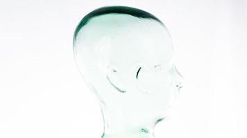a clear glass mannequin head spinning video