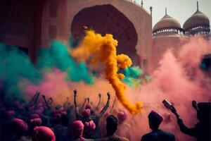 Crowd throwing bright coloured powder paint in the air. photo