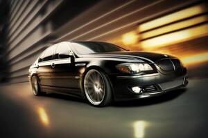 Front side view of black luxury sedan in turn, Fast Blur Background photo