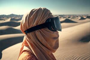 An Arab woman in a headscarf, portrayed in a hijab and a dark eye patch, looking out over a sandy desert with barchans. photo