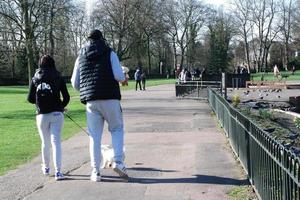 Gorgeous View of Wardown Public Park and People are Enjoying the Beautiful and Bright Sunny Day. They are Spending Day with Their Families and Having Fun. Image Was Captured at Luton on 03-April-2023 photo