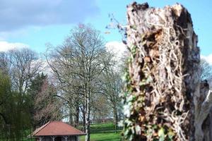 Gorgeous View of Wardown Public Park and People are Enjoying the Beautiful and Bright Sunny Day. They are Spending Day with Their Families and Having Fun. Image Was Captured at Luton on 03-April-2023 photo