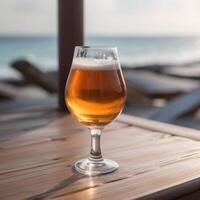 A beer glass on a wooden table photo