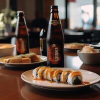 A bottle of beer next to a plate of sushi and a bottle of beer photo
