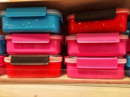 Food container  multicolored in rack,plastic lunch box in rectangular shape,snack container photo