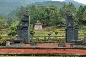 The gate of the Gedong Songo temple with the background of the first temple, located in Semarang district, Central Java photo