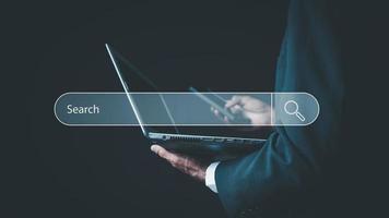 Searching Browsing Internet Data Information with blank search bar. business people working with computer and mobile for finding data. photo