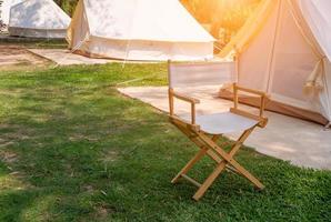 Camping picnic tent campground in outdoor hiking forest. Camper while campsite in nature background at summer trip camp. Adventure Travel Vacation concept photo