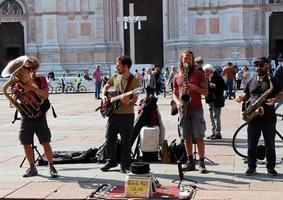 Bologna, Italy, April 16, 2022 Street performers playing music in the historic downtown district of Bologna. Italy photo