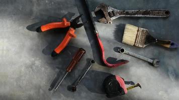 Set of assorted work tools. Various carpentry tools on wooden background. photo