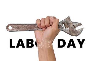 Hand holding a wrench on a white background. Labor day concept photo