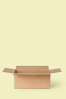 Cardboard box for delivery, parcels. On a yellow background photo