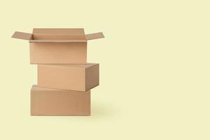 several cardboard boxes for delivery, parcels. On a yellow background. photo