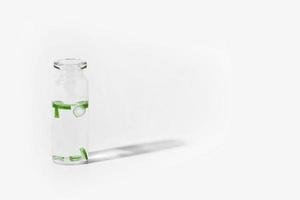 organic cosmetics, natural cosmetics, biofuels, algae. Natural green laboratory. Experiments. Glass laboratory jar with green plants on a light background. photo