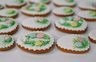 A table with decorated Easter cookies on it photo