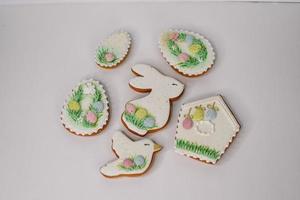 A table with decorated Easter cookies on it photo