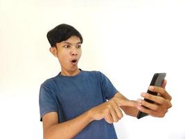 Asian man being Shock and surprised after watching from smartphone photo