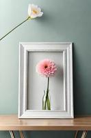 Minimal White Picture Frame Canvas Display With Flower in Vase photo