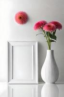 Minimal White Picture Frame Canvas Display With Flower in Vase photo