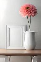 Minimal White Picture Frame Canvas Display With Flower in Vase photo