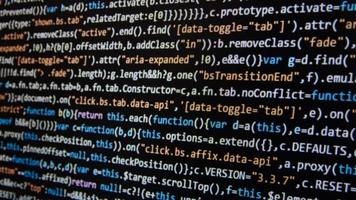 Computer program code on a black background. Close-up. High quality photo