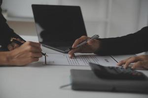 Close up view of job interview in office, focus on resume writing tips, employer reviewing good cv of prepared skilled applicant, recruiter considering application, hr manager making hiring decision photo