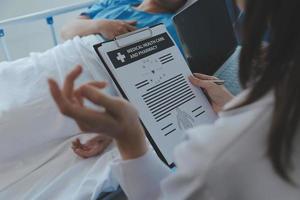 Women Asian doctors hold the patient hand and encourage and provide medical advice While checking the patient health in bed. Concept of Care and compassion, antenatal care, Threatened abortion photo