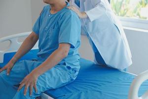 Women Asian doctors hold the patient hand and encourage and provide medical advice While checking the patient health in bed. Concept of Care and compassion, antenatal care, Threatened abortion photo