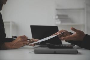 Close up view of job interview in office, focus on resume writing tips, employer reviewing good cv of prepared skilled applicant, recruiter considering application, hr manager making hiring decision photo
