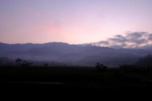 The Call of the Wild An Epic Landscape of Mountains at Dawn photo