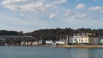 BEAUMARIS, ANGELSEY, UK - APRIL 08. View of houses by the beach in Beaumaris, Angelsey on April 08, 2023. Unidentified people photo