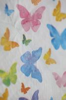 Colorful butterflies on white napkin paper close up background big size high quality instant print stock photography photo