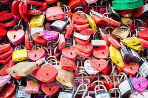 Verona, Italy - background of heart-shaped locks on a wall, symbol of love forever. photo