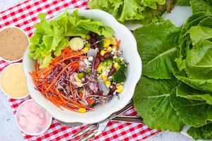 Thai food vegetable salads on salads bowl with salad dressing fresh vegetable fruit nuts and grains for healthy food mixed vegetable salad vegetarian green and colorful food for breakfast photo