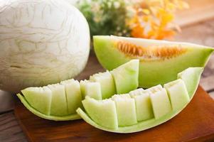 cantaloupe melon on wooden plate, cantaloupe thai slice fruit for health green cantaloupe thailand photo