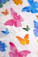 Colorful butterflies on white napkin paper close up background big size high quality instant print stock photography photo