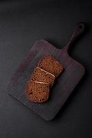 Loaf of fresh crispy brown bread with grains and seeds photo