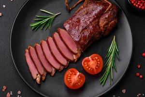 Delicious duck fillet or breast grilled or smoked with spices and salt photo