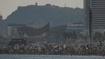 Crowds of people on the beaches of barcelona in summer video