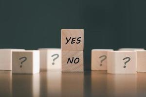 concept of choice yes or no on wooden cubic blocks. Business and lifestyle concept. Think With Yes Or No Choice, Business Choices For Difficult Situations, two wooden with yes or no word on it. photo