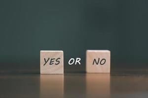 concept of choice yes or no on wooden cubic blocks. Business and lifestyle concept. Think With Yes Or No Choice, Business Choices For Difficult Situations, two wooden with yes or no word on it. photo