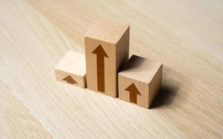 Growth graph chart from blocks with arrows. Development and growth, moving up. Competition concept. Summing up the results. Rise visualization photo