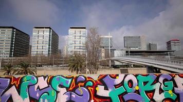 A timelapse on a sunny day of the towers and high rises of barcelona's diagonal mar district next to the sea video