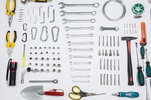 Set of tools for repair in a case on a white background. Assorted work or construction tools. Wrenches, Pliers, screwdriver. Top view photo