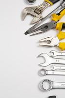 Set of tools for repair in a case on a white background. Assorted work or construction tools. Wrenches, Pliers, screwdriver. Top view photo