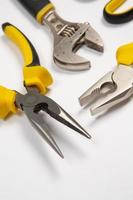 Set of tools for repair in a case on a white background. Assorted work or construction tools. Wrenches, Pliers, screwdriver. Top view photo