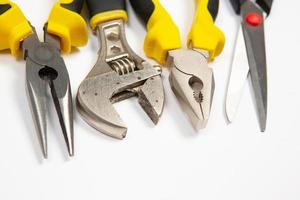 Set of tools for repair in a case on a white background. Assorted work or construction tools. Wrenches, Pliers, screwdriver. Top view photo