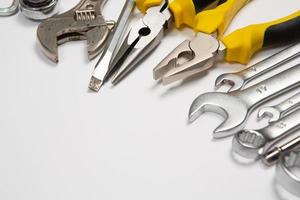 Set of tools for repair in a case on a white background. Assorted work or construction tools. Wrenches, Pliers, screwdriver. Top view photo