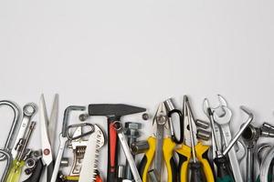 Set of tools for repair in a case on a white background. Assorted work or construction tools. Wrenches, Pliers, screwdriver. Top view photo