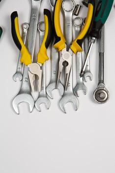 Set of tools for repair in a case on a white background. Assorted work or construction tools. Wrenches, Pliers, screwdriver. Top view photo